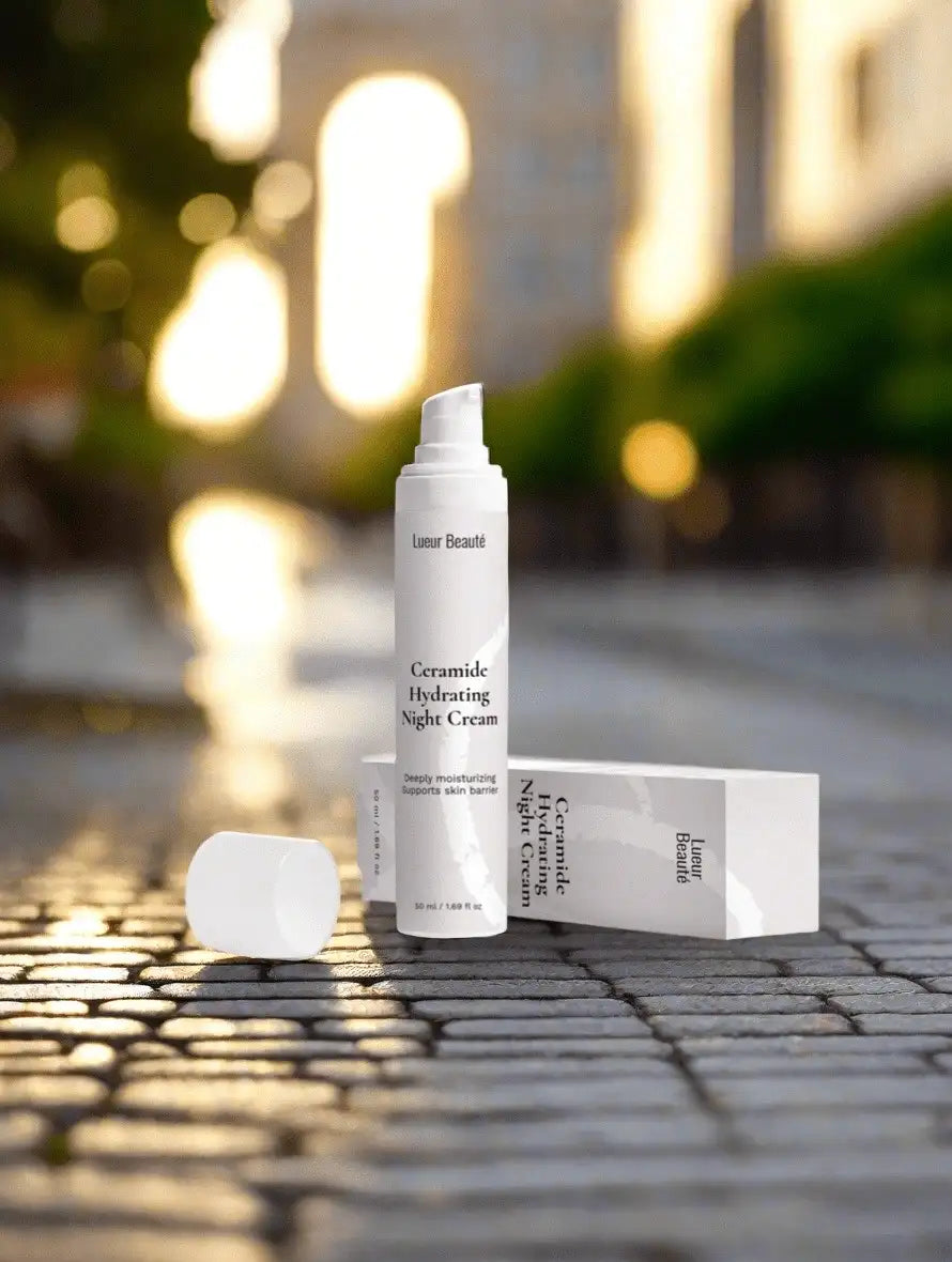 Lueur Beauté Ceramide Hydrating Night Cream on cobblestone street at sunset with packaging – deeply moisturizing night cream