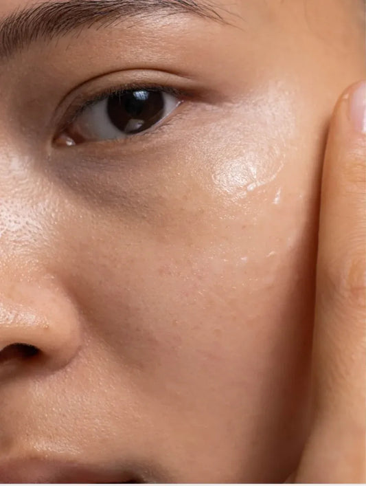 Applying niacinamide gel moisturiser on face for hydration and brighter skin tone