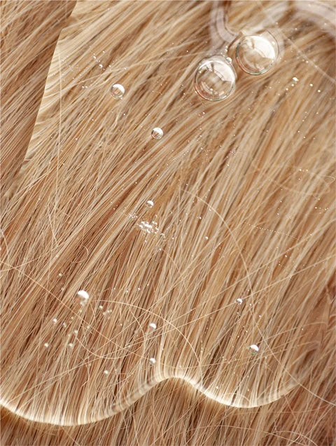 Gentle shampoo texture applied to hair for sensitive scalp