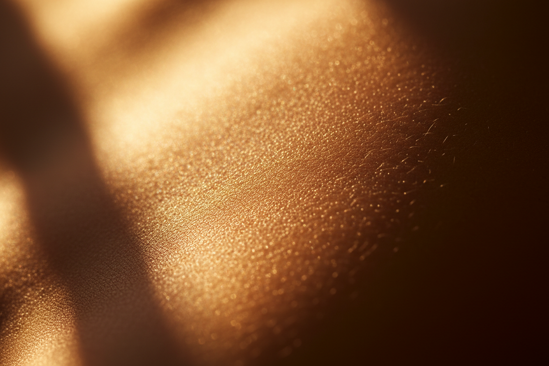 Close-up of glowing skin in warm golden sunlight — how to choose SPF for your skin tone guide by Lueur Beauté
