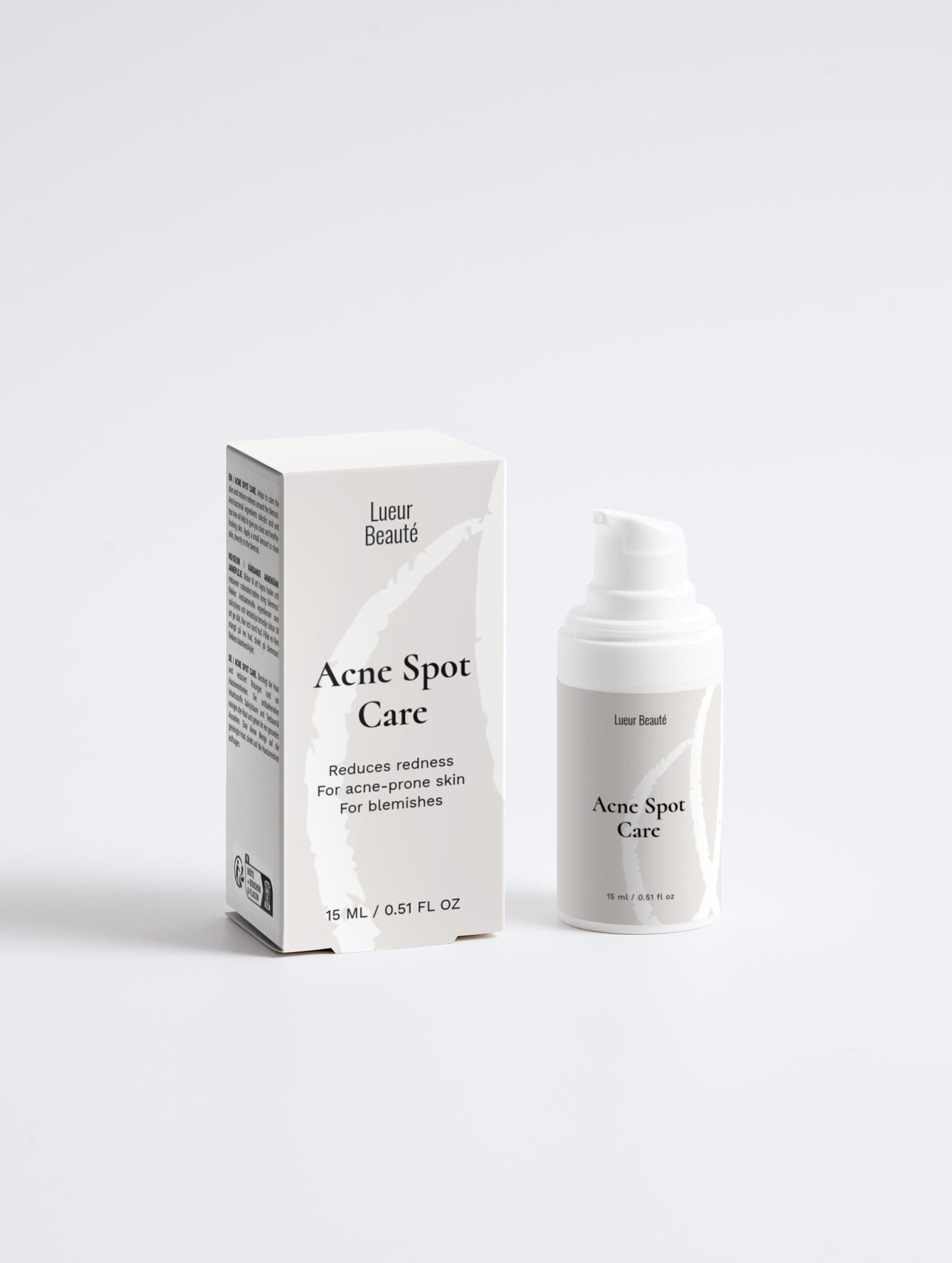 Lueur Beaute Acne spot care product packaging on a white background