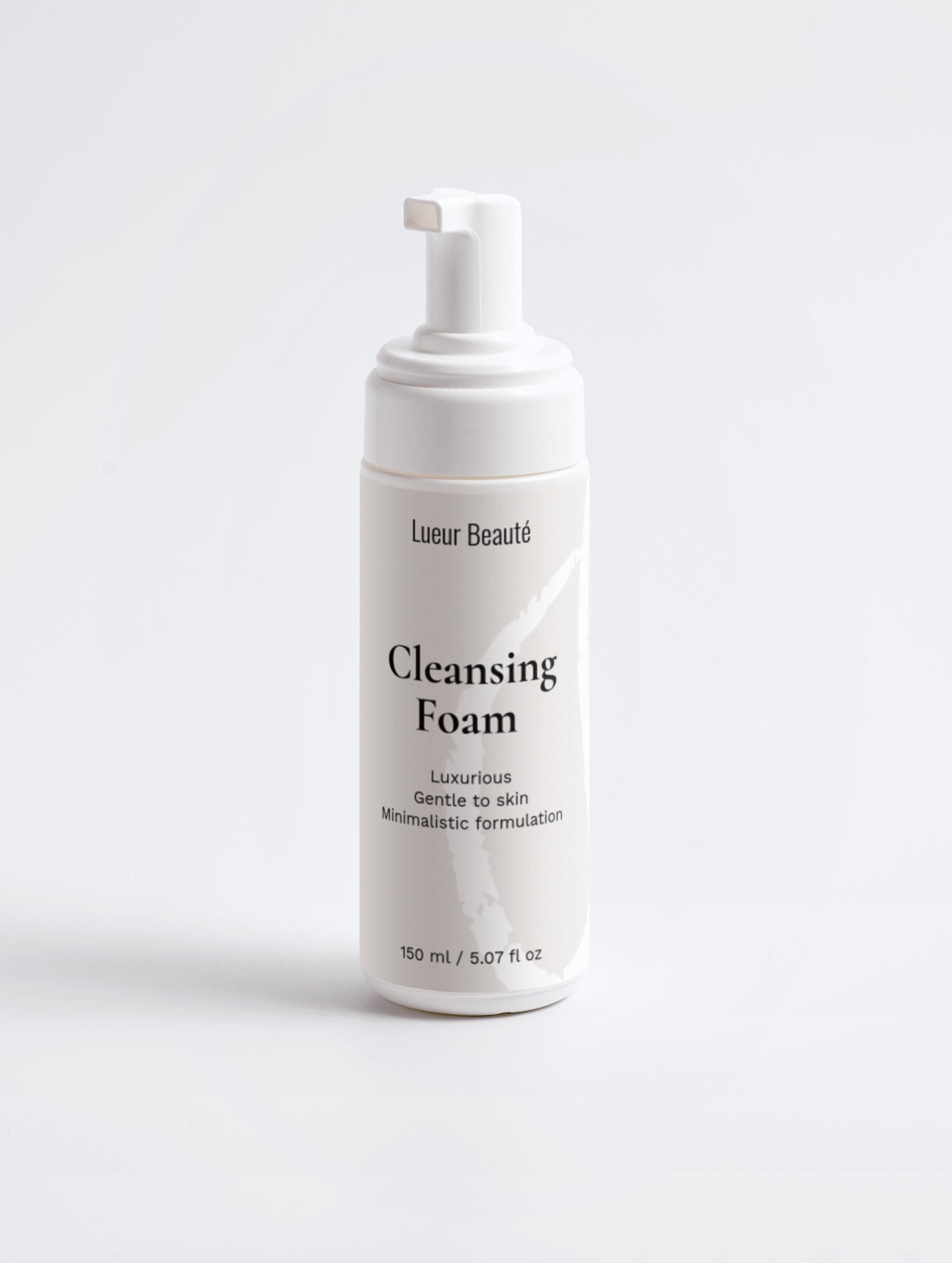 Cleansing foam bottle with pump on a white background