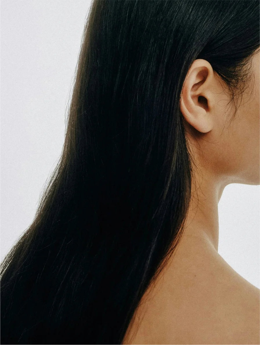 Keratin shine leave-in hair mist on smooth, shiny hair to enhance softness and natural gloss