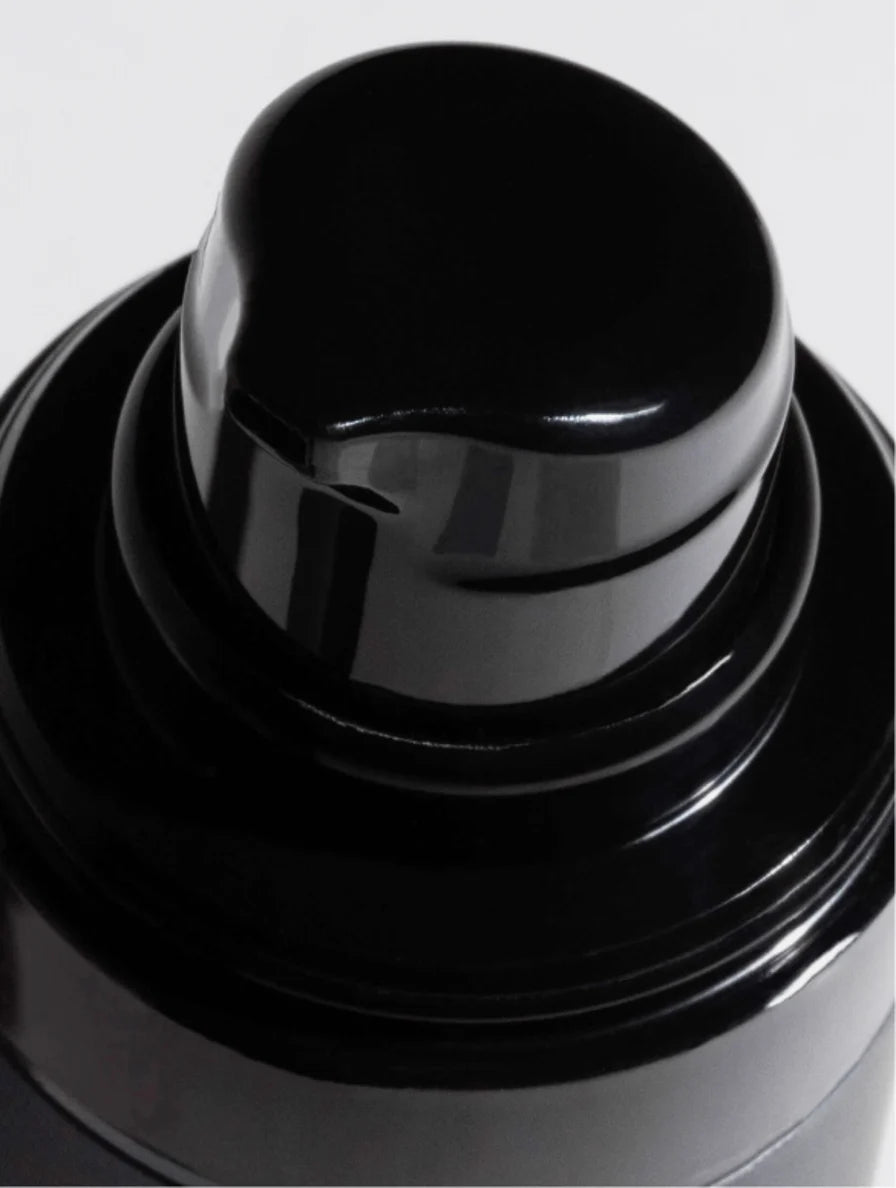 Close-up of the glossy black dispenser pump on the Oil-Free Hydrating Gel bottle.