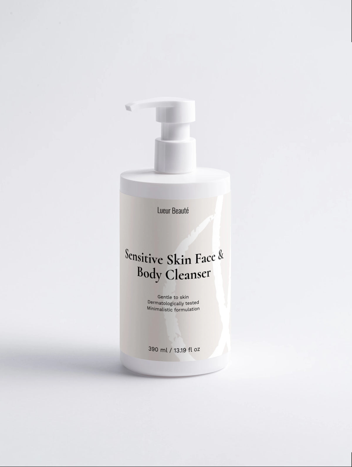 Front view of a white Lueur Beauté Sensitive Skin Face & Body Cleanser pump bottle, 390 ml, on a light background