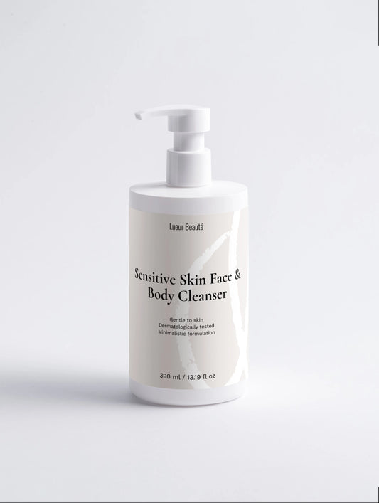 Front view of a white Lueur Beauté Sensitive Skin Face & Body Cleanser pump bottle, 390 ml, on a light background