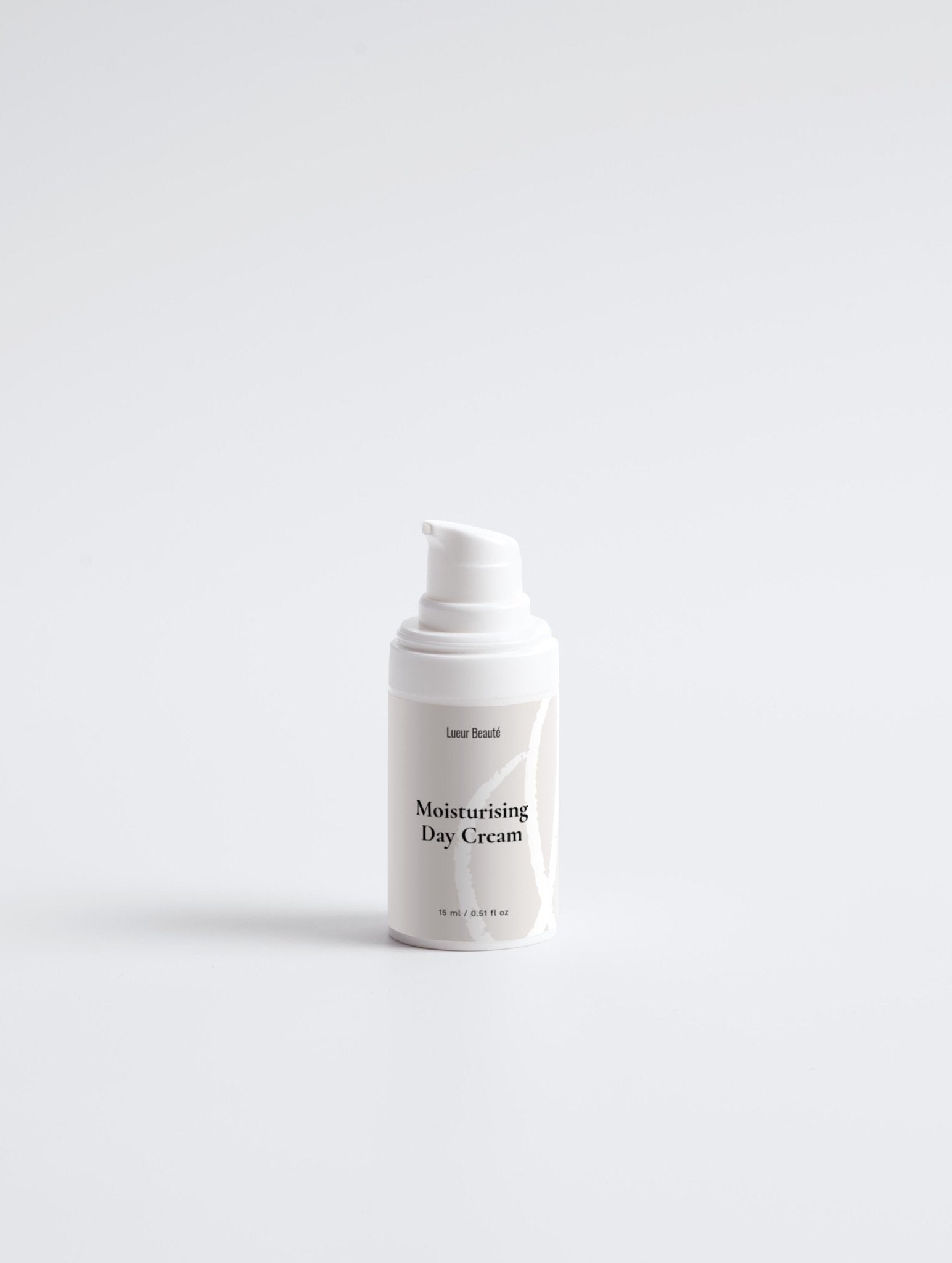 White bottle of moisturizing day cream on a white background