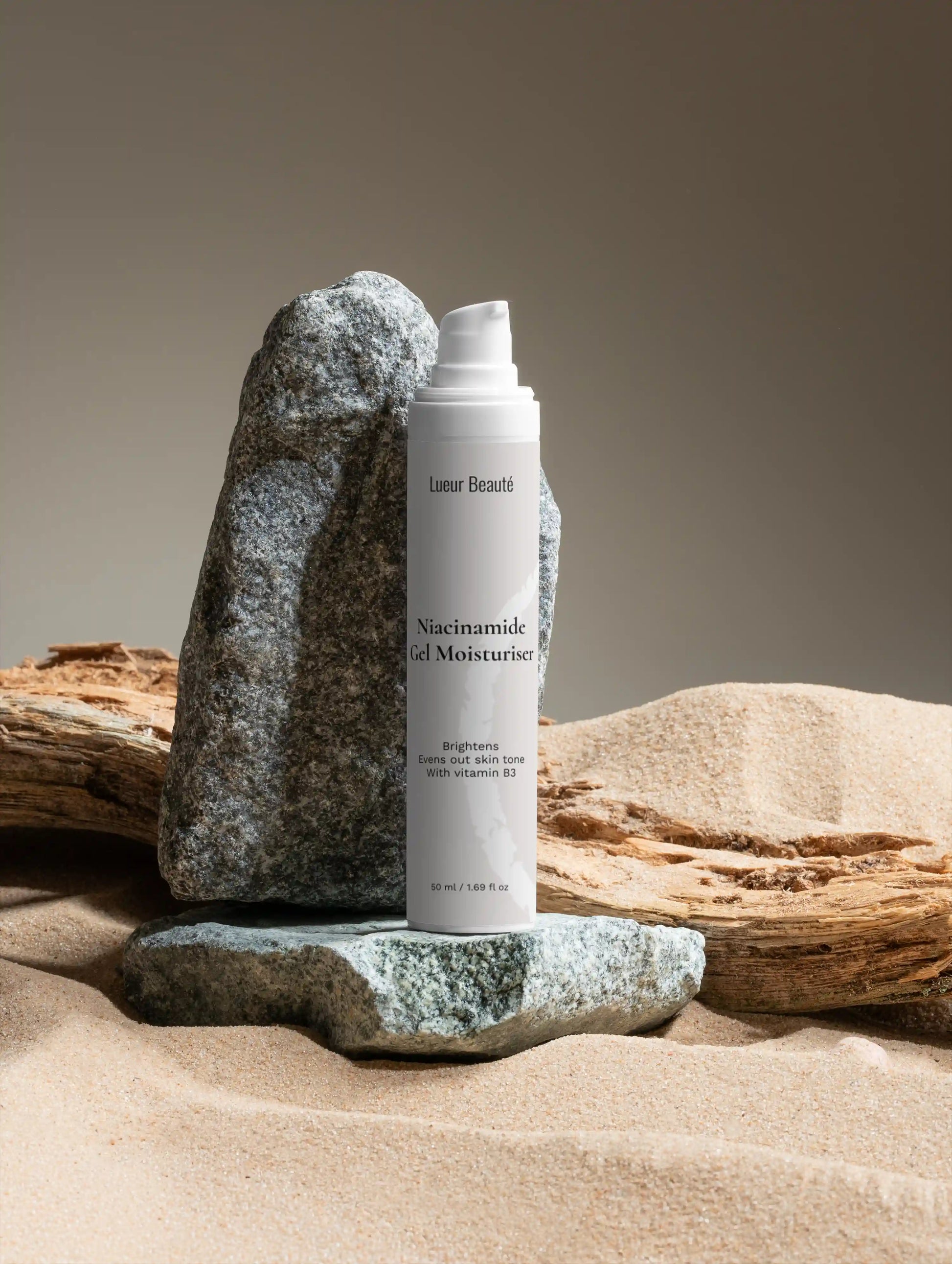 Niacinamide gel moisturiser on natural stone background for clean skincare aesthetic