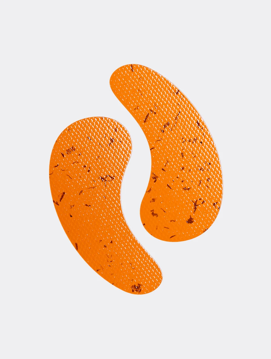 Pair of orange Anti-Fatigue Hydrogel Under Eye Patches with botanical particles