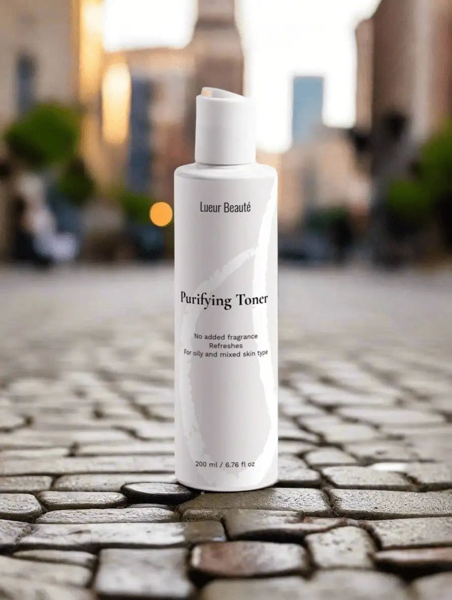 Lueur Beauté Purifying Toner standing on cobblestone street with blurred warm city background