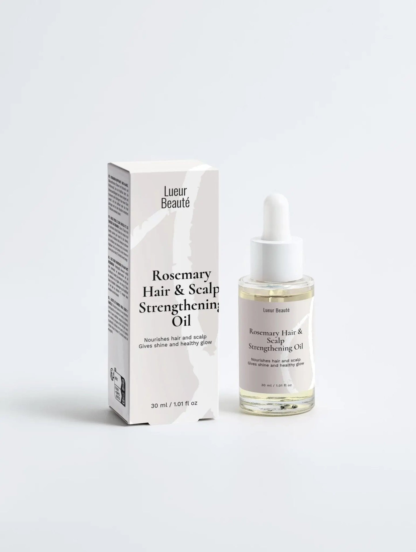 Lueur Beauté Rosemary Hair & Scalp Strengthening Oil bottle for hair growth and scalp nourishment.