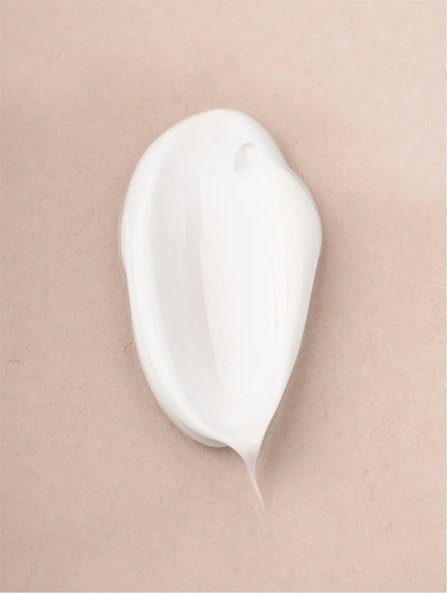 Sensitive body cream texture on skin showing gentle, nourishing formula suitable for sensitive and dry skin