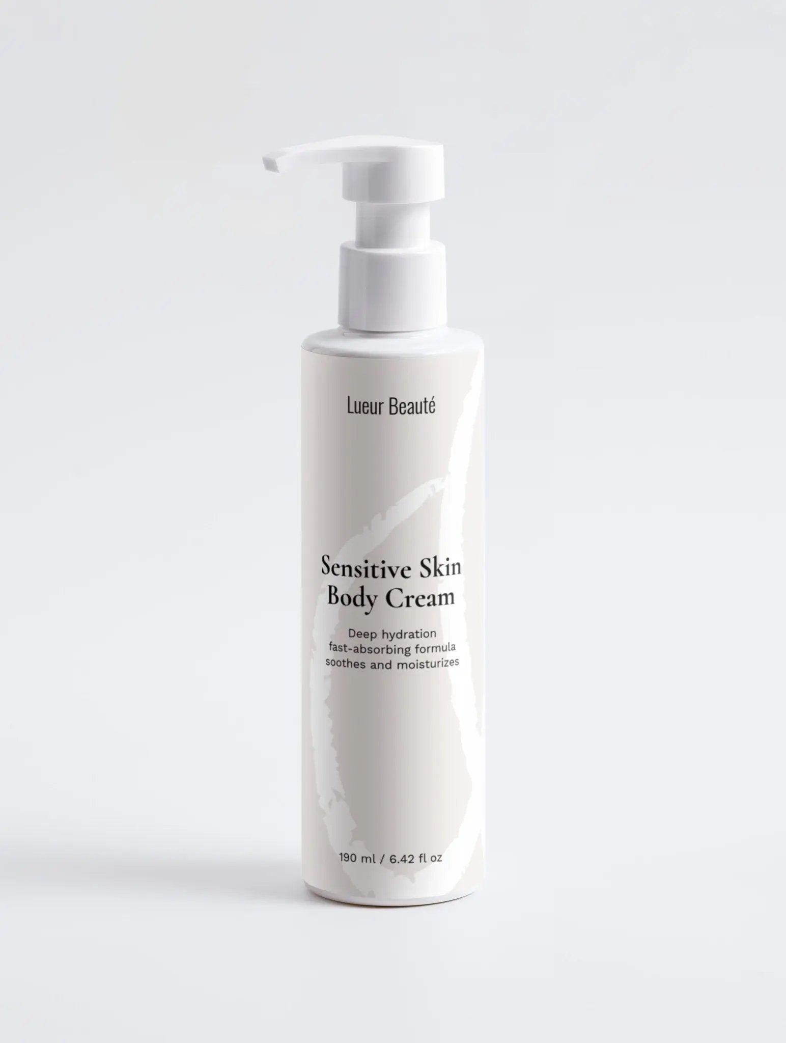 Lueur Beauté Sensitive Skin Body Cream bottle standing on a clean white background in a minimal studio setting.