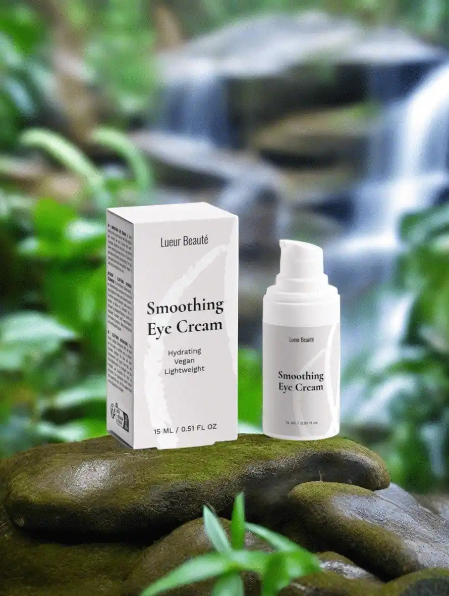 Lueur Beauté Smoothing Eye Cream with box on mossy stones in front of waterfall, natural skincare scene