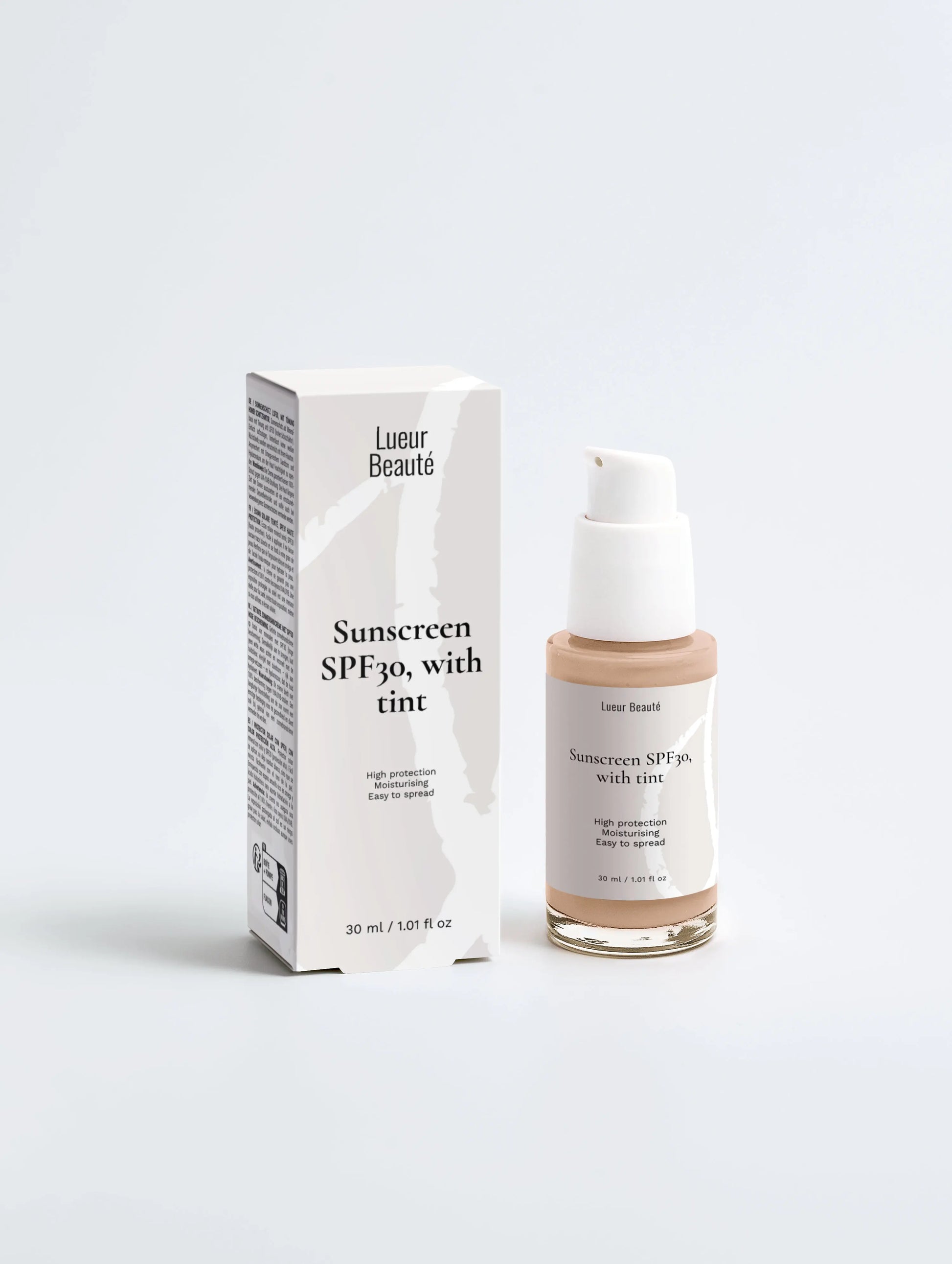 Lueur Beauté tinted mineral sunscreen SPF30 bottle with packaging on white background