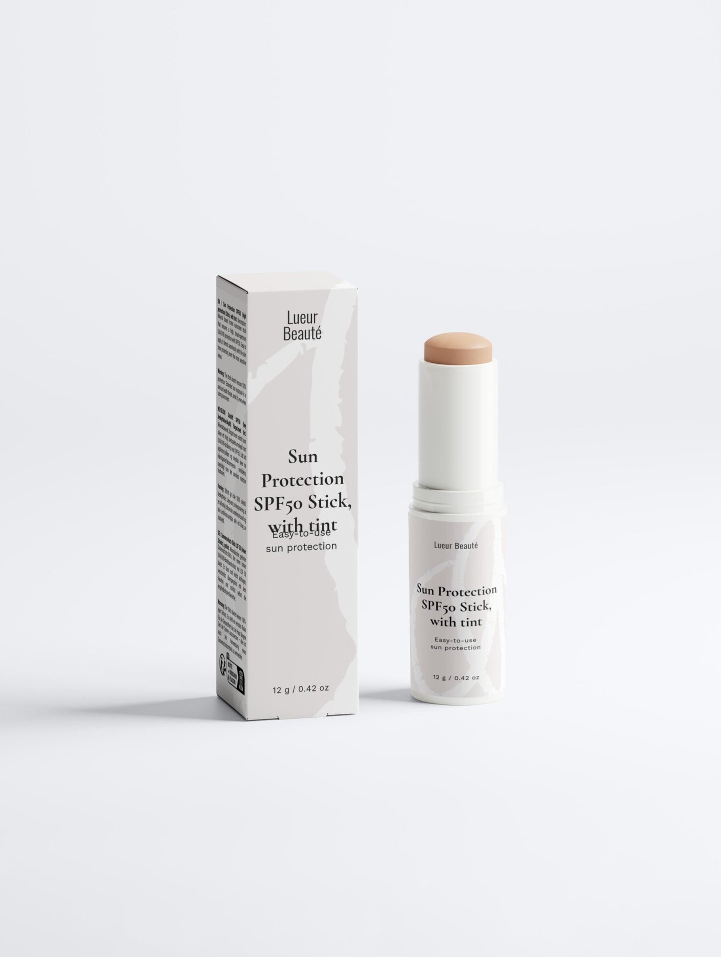 Tinted Sun Protection SPF50 Stick with tint displayed with product box on white background