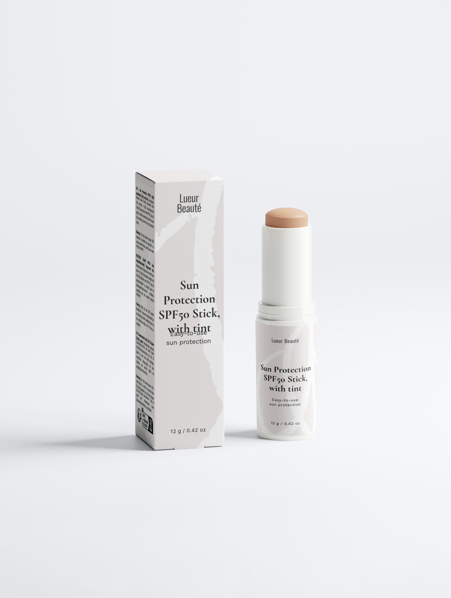 Tinted Sun Protection SPF50 Stick with tint displayed with product box on white background