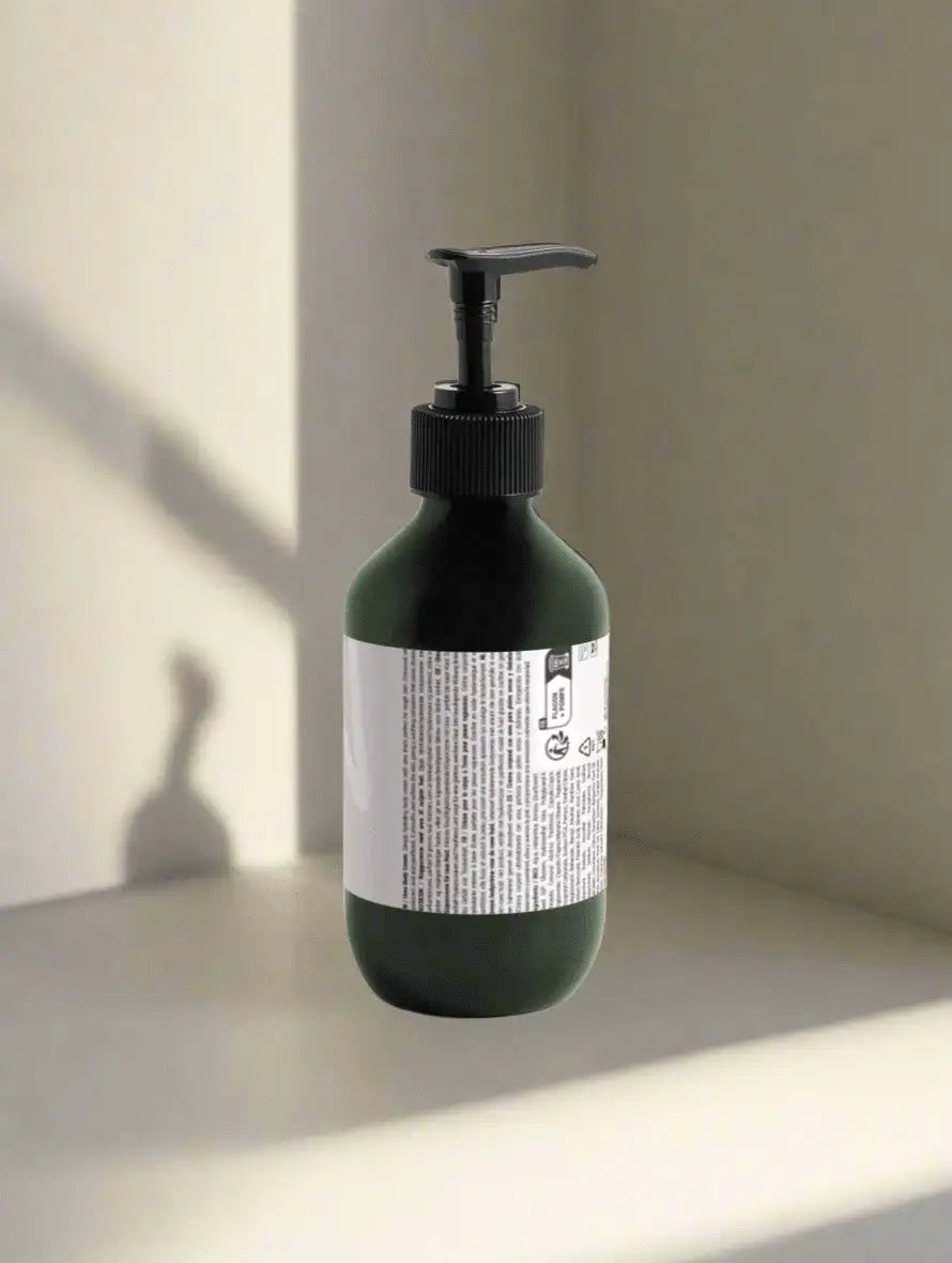 Back view of Lueur Beauté Urea Body Cream for Rough Skin showing product label on a minimalist beige background