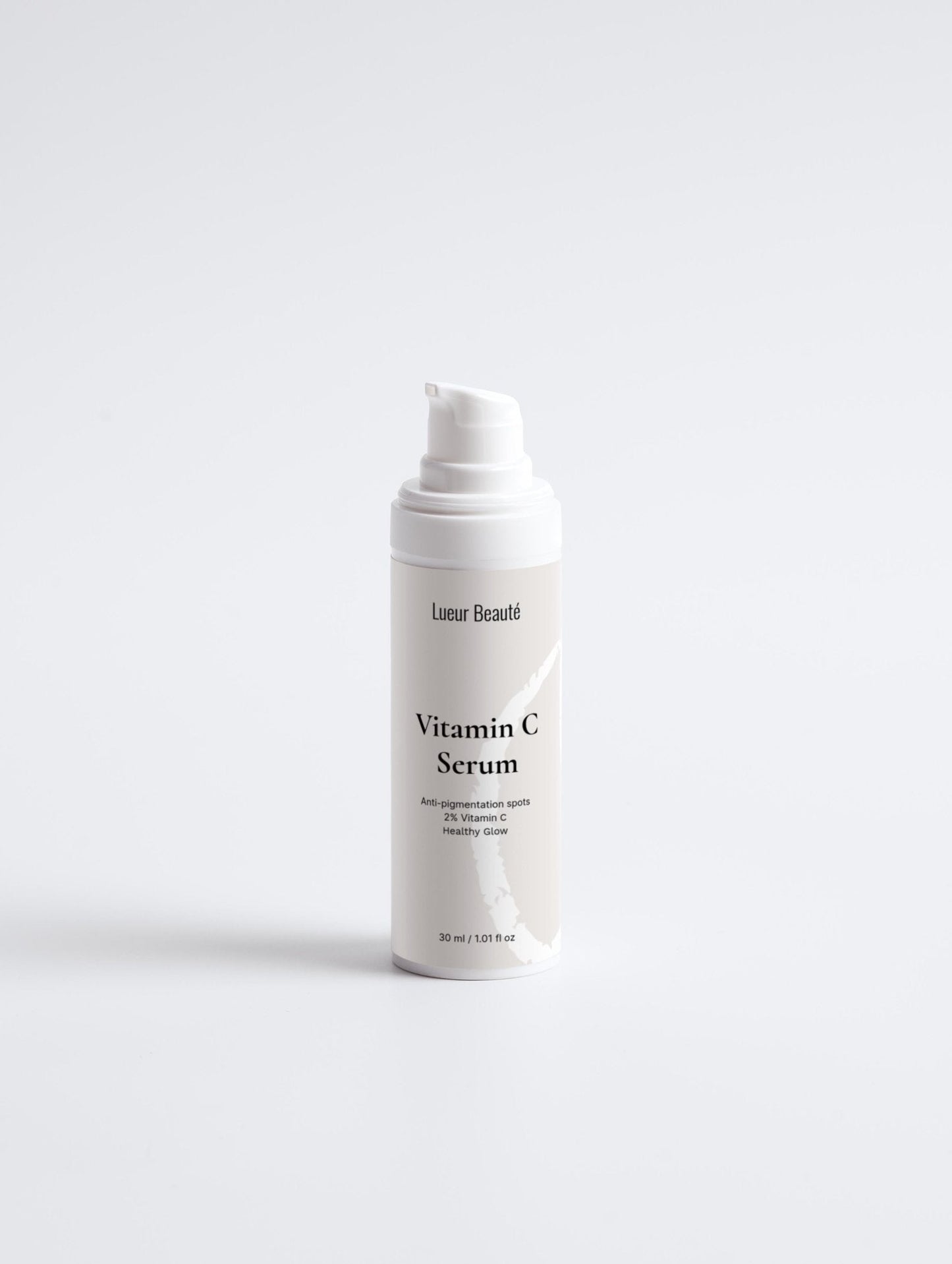 Lueur Beauté  bottle of Vitamin C Serum on a light gray background