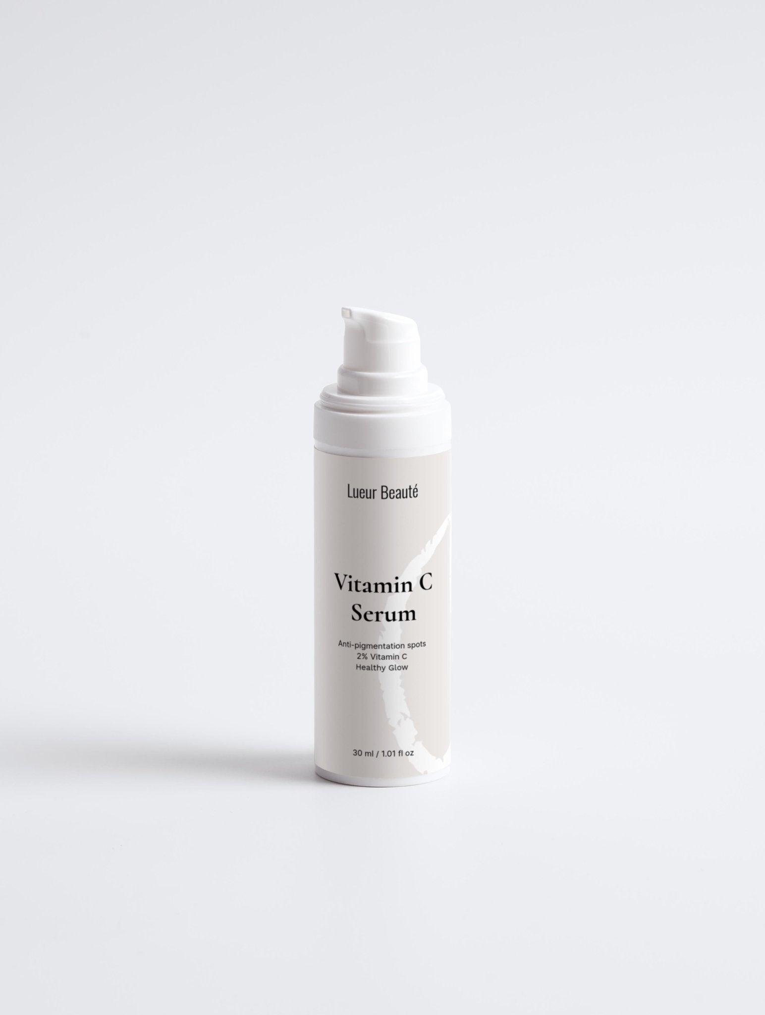 Lueur Beauté  bottle of Vitamin C Serum on a light gray background