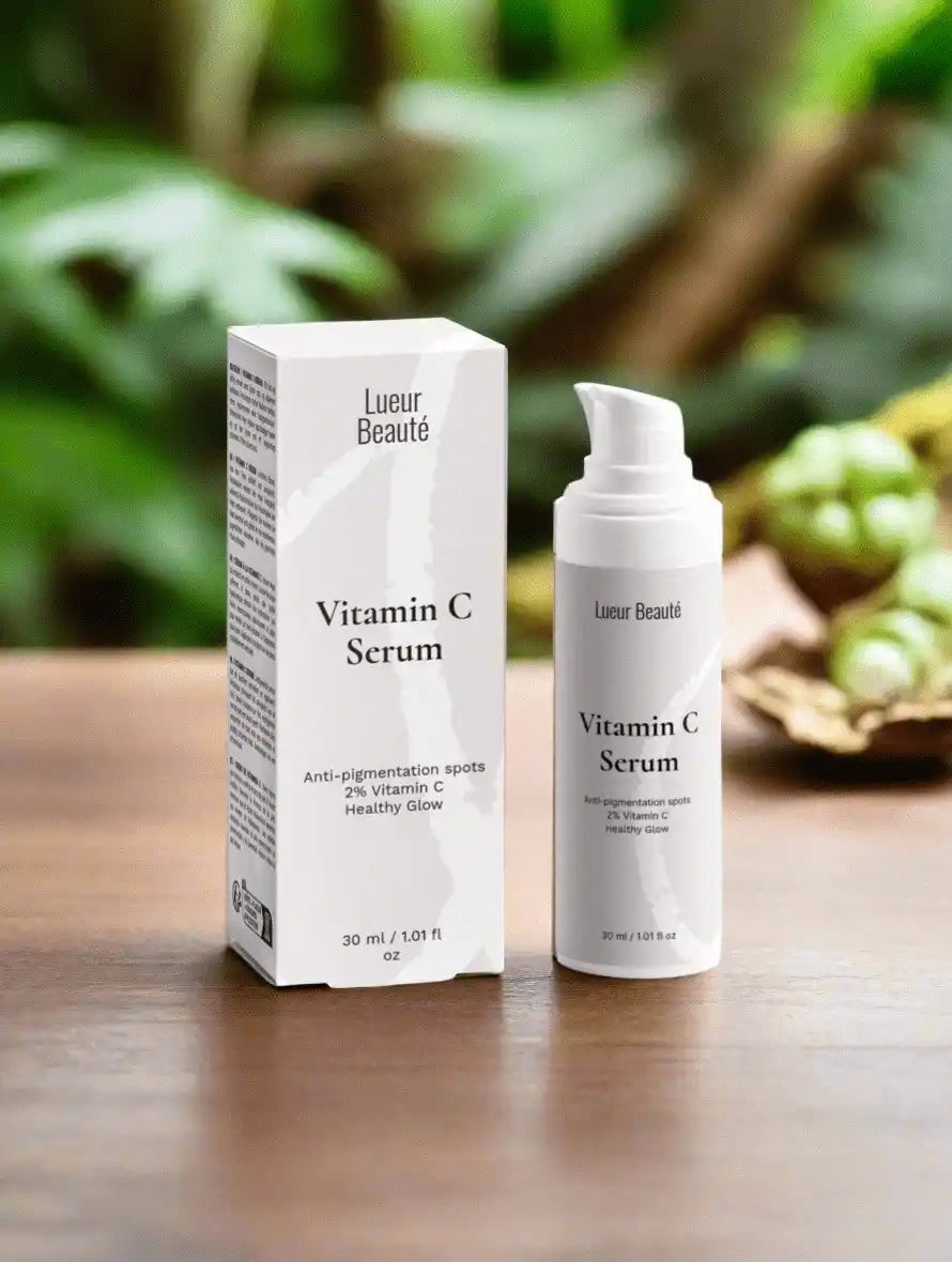 Lueur Beauté Vitamin C Serum with box on a wooden table, natural green background